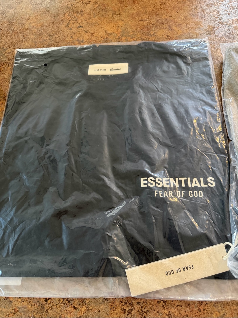 Fear of God Essentials Black and tan Short Sleeve Logo Tees